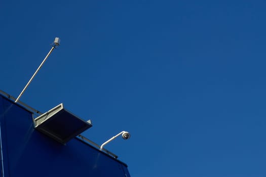Surveillance cameras roof of a retail space a
