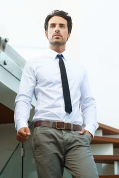 Corporate, businessman with professional outfit on stairs. Business office worker or accountant, young executive or employee looking focused and elegant with person thinking at workplace on steps