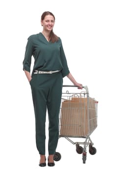 Full length portrait of a woman pushing a shopping trolley