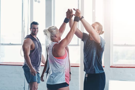Celebrate even the tiniest of victories. a fitness group celebrating a victory at the gym