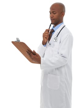 Pondering over your medical chart. A young doctor looking pensively at your medical chart.