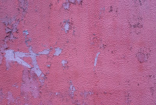 Cracked peeling red paint background texture