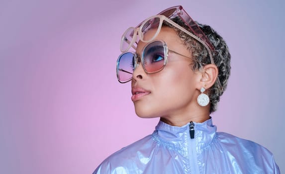 Sunglasses, fashion and black woman in neon clothes in color studio mock up space for advertising and marketing. Gen z girl or african model with futuristic vaporwave style on purple pink background