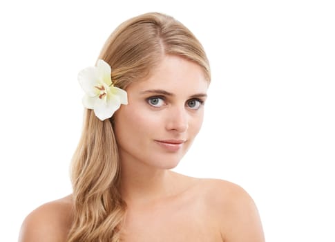 Head and shoulders above beauty. Studio portrait of a blonde woman with a flower in her hair isolated on white.