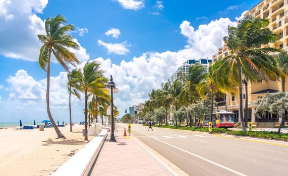 Beach promenade with palm trees on a sunny day in Fort Lauderdale