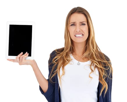 New age separation anxiety. A young woman looking displeased as she holds a tablet.
