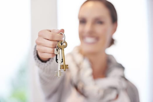 Its all yours now. A real estate agent handing you the keys to your new home.