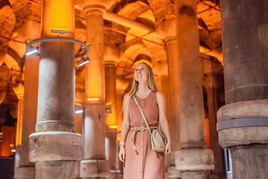 Woman tourist enjoying Beautiful cistern in Istanbul. Cistern - underground water reservoir build in 6th century, Istanbul, Turkey, Turkiye