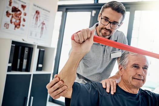Building strength through stretching. a friendly physiotherapist helping his mature patient to stretch at a rehabilitation center.