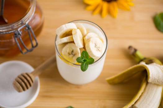 Sweet homemade yogurt with bananas and honey
