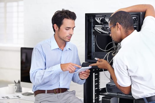 Server room, it support and instructions with a man technician talking to a business person about cyber security. Network, database and explain with an engineer chatting about information technology