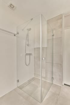 a shower with a glass door in a bathroom