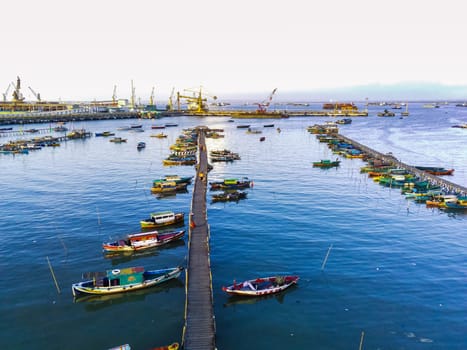 Aerial top down on traditional colourful asian fisherman boats moored in Gresik, Indonesia.