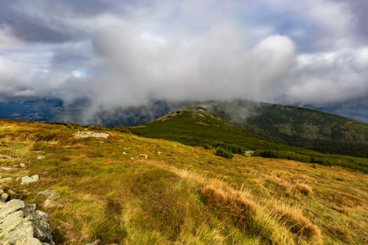 Beautiful cloudy green landscape around Sniezka mountain in Giant mountains