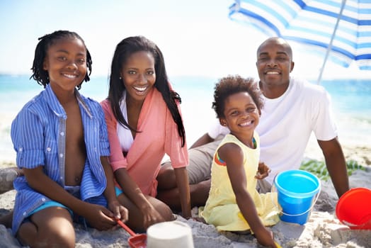 Picnic in the sun. An african-american family enjoying a day at the beach.