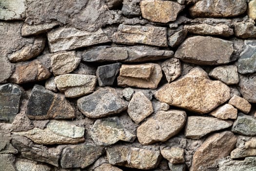 Background of natural stones bonded with cement mortar