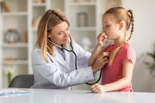 Pediatrician Lady With Stethoscope Listening Lungs Of Coughing Little Girl During Checkup