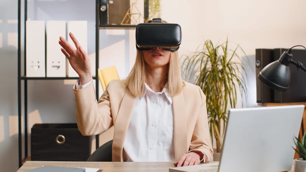Business woman using virtual reality futuristic technology VR app headset to simulation 3D video