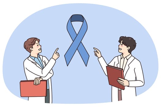 Male doctors discuss patient cancer diagnosis