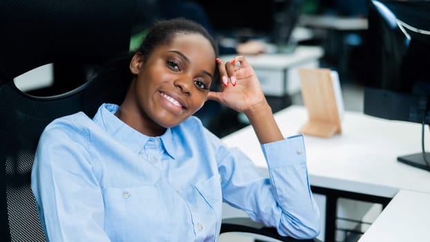 African young woman at the workplace in the office.