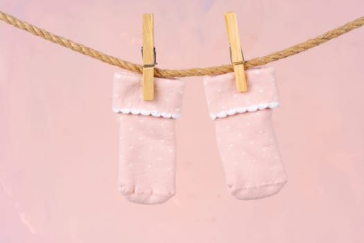 Baby socks on a clothesline. Baby clothes washing