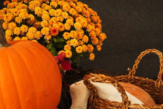 Close up shot of a pumpkin and basket, autumn composition