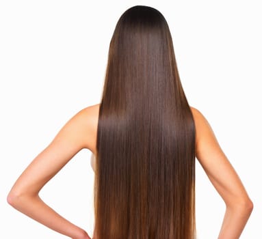 Hair goals. Rearview studio shot of a young woman with long silky hair against a white background.