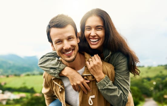 Happy, love and piggyback with portrait of couple in nature for happy, smile and bonding. Happiness, relax and care with face of man carrying woman on countryside date for spring, vacation in Brazil