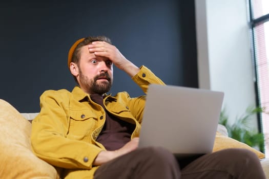 Shocked user's reaction to online content he discovered on internet. man's expression reflects mix of excitement, surprise, and astonishment comes across something unexpected and thrilling.
