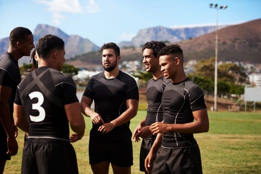 Champions are born on a field. a group of young rugby players having a discussion on the field.