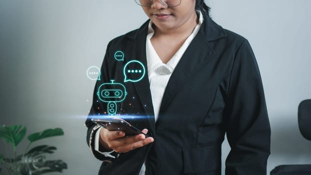 Businesswoman hand uses a smartphone to type live chat, ask, answer with an artificial intelligence system. chat bot. Ai.