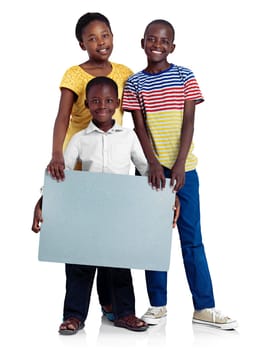 A message from us. Studio shot of three african siblings with a blank board against a white background.
