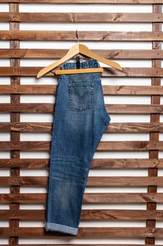 Jeans on wooden background