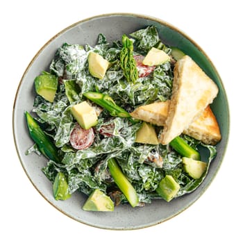 Portion of green spinach salad with avocado