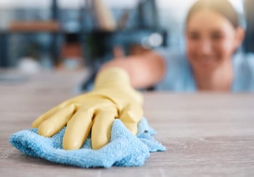 Hand, woman and table cleaning for hygiene, housework and household cleansing in an apartment. Hands, girl and clean product for dust, dirt and germs, bacteria and illness prevention on surface