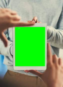 Picture this.... Cropped shot of two unrecognizable businessmen framing a digital tablet with a green screen.