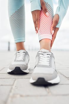 Fitness, injury and woman with shin pain during cardio exercise, training or outdoor workout. Closeup of an athlete with a sports accident, muscle sprain or medical emergency while running outside.