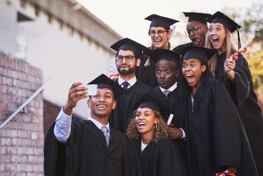Now thats a picture of perseverance. a group of students taking a selfie on graduation day.