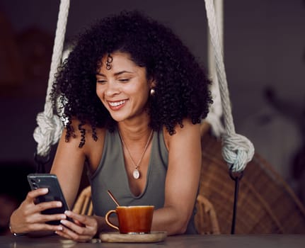 Black woman, phone and coffee in cafe, restaurant or coffee shop on social media, internet news or fun esports game. Happy smile, relax afro student and entrepreneur with tea cup or mobile technology