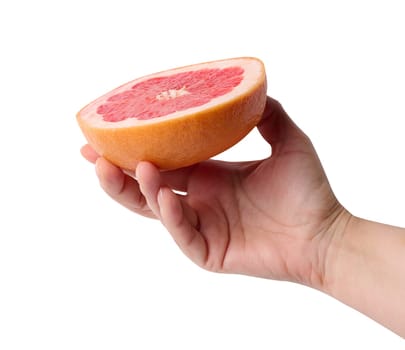 A woman's hand holds half a grapefruit on a white isolated background