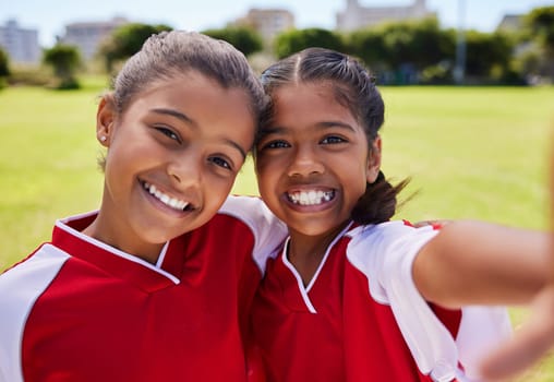 Girl, selfie and friends on field for soccer with happiness at training, game or competition. Team, children and happy together smile on grass for football, exercise or match in Los Angeles in summer