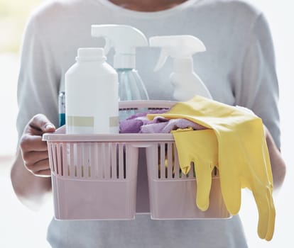 Cleaning service, product basket and cleaner hands for career working in home, house or office with product bottle and gloves. Housekeeper liquid, detergent and plastic spray for spring cleaning job