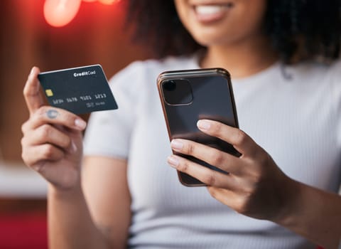 Woman hands, phone and credit card for ecommerce, online shopping and making payment on internet store or bills with fintech app. Female doing banking with secure smartphone network for savings