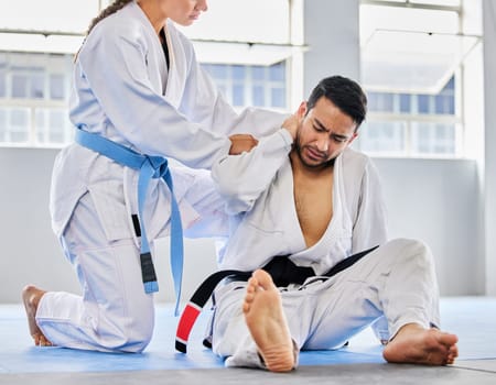 Karate, neck pain and man with an injury in sports training, exercise or body workout hurt in an accident. Problem, emergency and injured martial arts expert or athlete with muscle pain or bruise