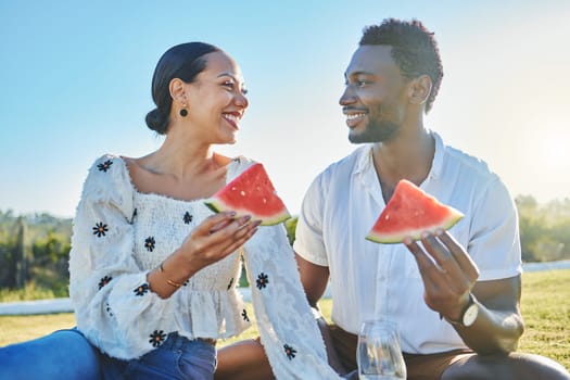 Watermelon, love or black couple on a picnic to relax on a summer holiday vacation in nature or grass. Partnership, romance or happy black woman enjoys traveling or bonding with a funny black man.