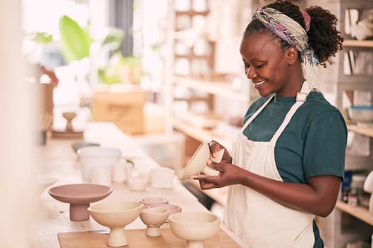Ceramic store, creative pottery and black woman working on sculpture design mold, manufacturing or art product. Creativity, molding and startup small business owner, worker or girl in studio workshop