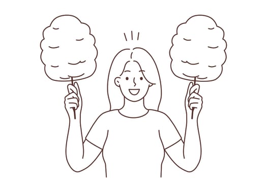 Smiling woman holding cotton candy