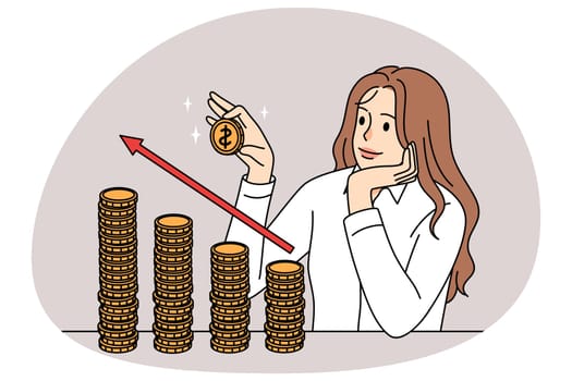 Successful businesswoman stacking coins
