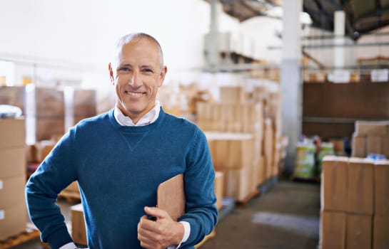 All your import and export needs. Portrait of a mature man standing in a distribution warehouse.