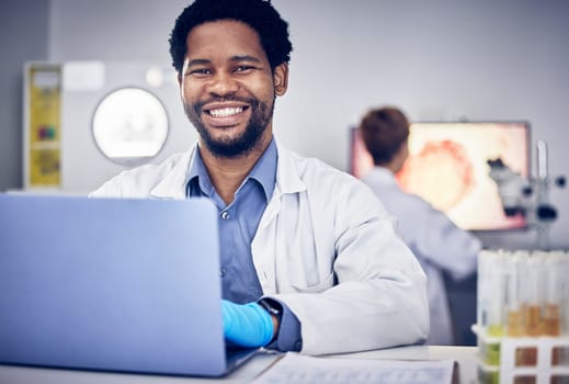 Portrait, scientist and black man with laptop, laboratory and research for healthcare. Male, researcher or science for medical diagnosis, cure and online analysis for data, sample and innovation tech